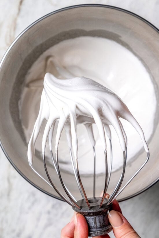 Light and airy peppermint meringues are the perfect addition to any holiday cookie tray! They're surprisingly easy to make and always a hit. Whisk attachment with stiff peaks of meringue