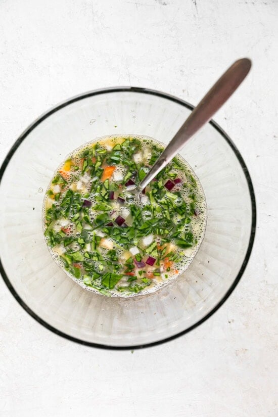 Beat eggs and egg whites and add veggies.