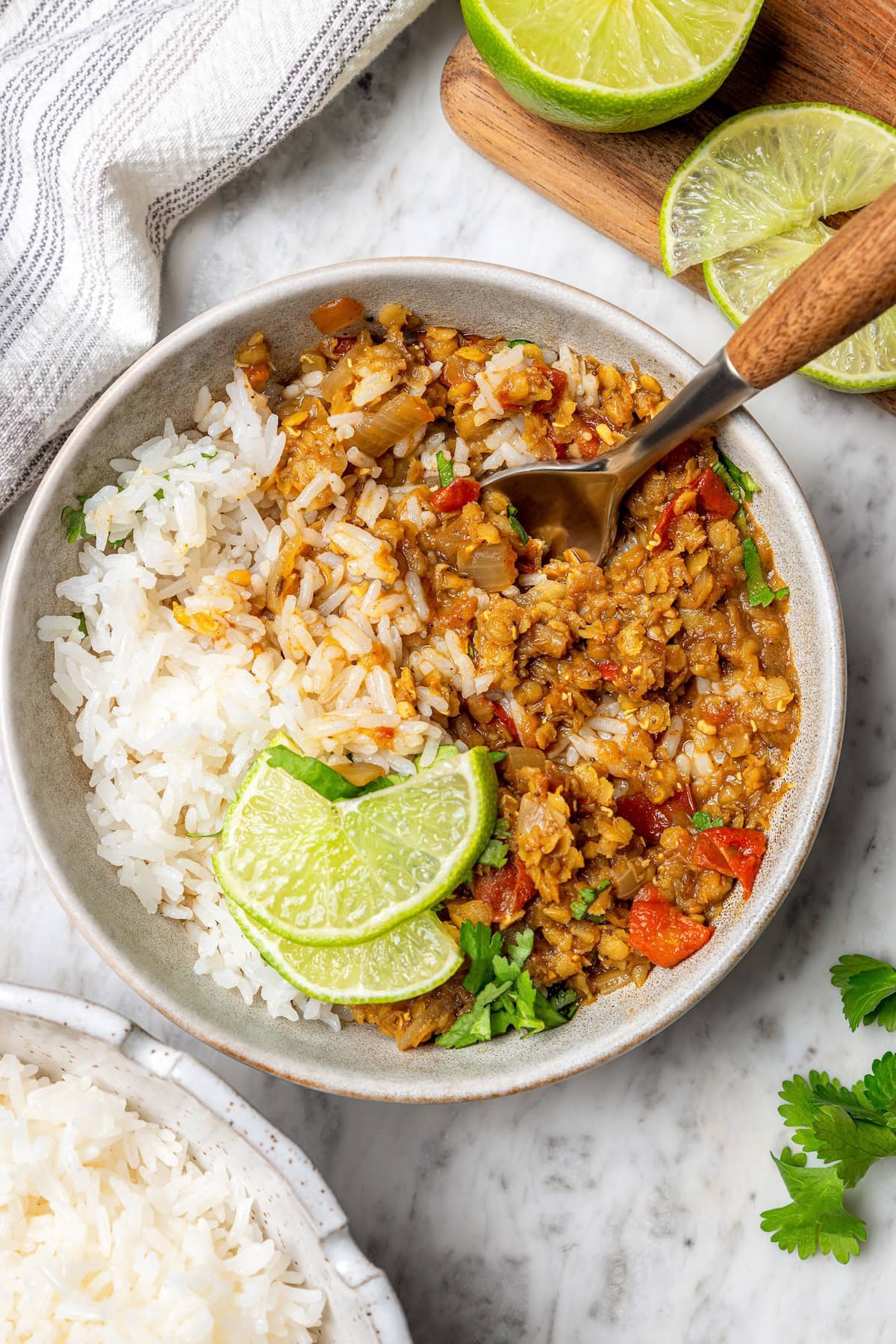 Jasmine rice is a fragrant rice perfect for pairing with curries and stir fries! Make it in the Instant Pot and it's easy, fluffy, and tasty. Jasmine rice in bowl with curry