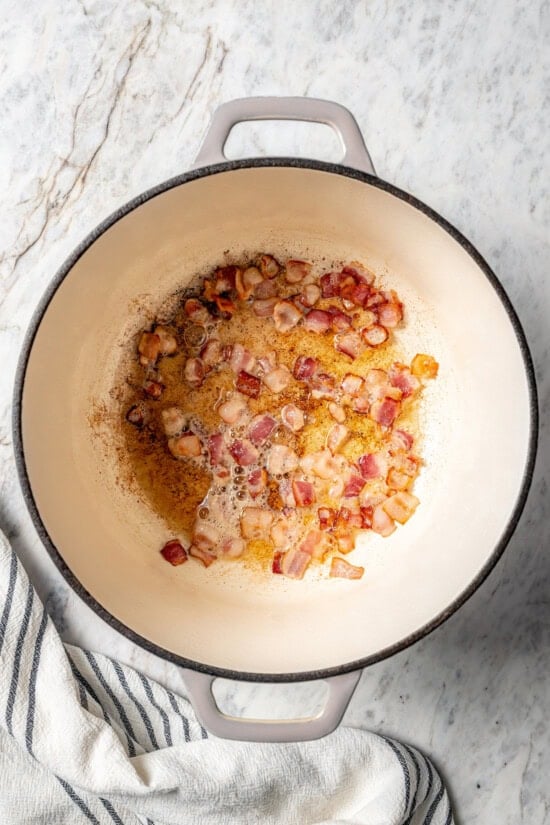 Bacon cooking in Dutch oven