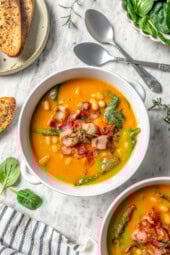 Overhead view of navy bean soup with bacon and spinach