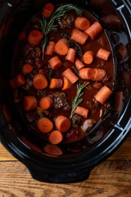 Transfer the the slow cooker with the carrots.
