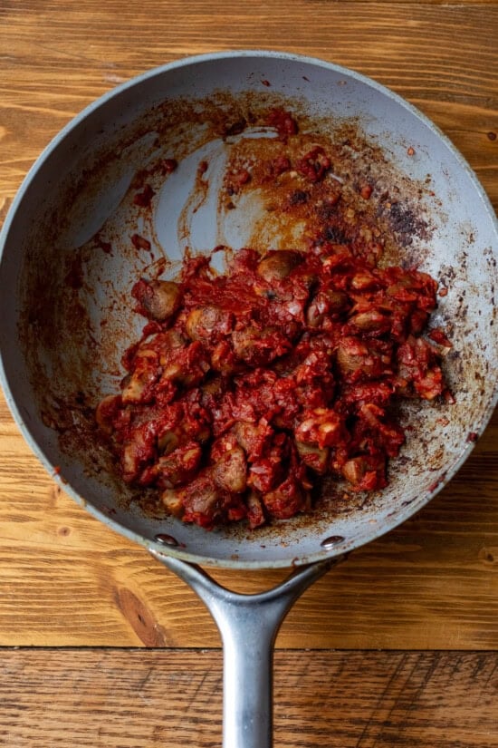 Add mushrooms, shallots, garlic and tomato paste.