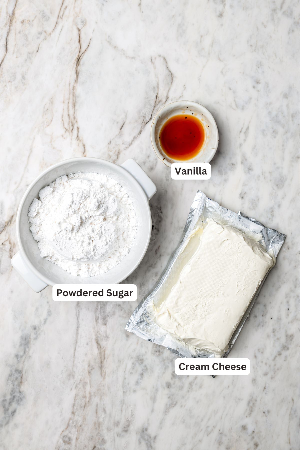Overhead view of frosting ingredients for fruit pizza