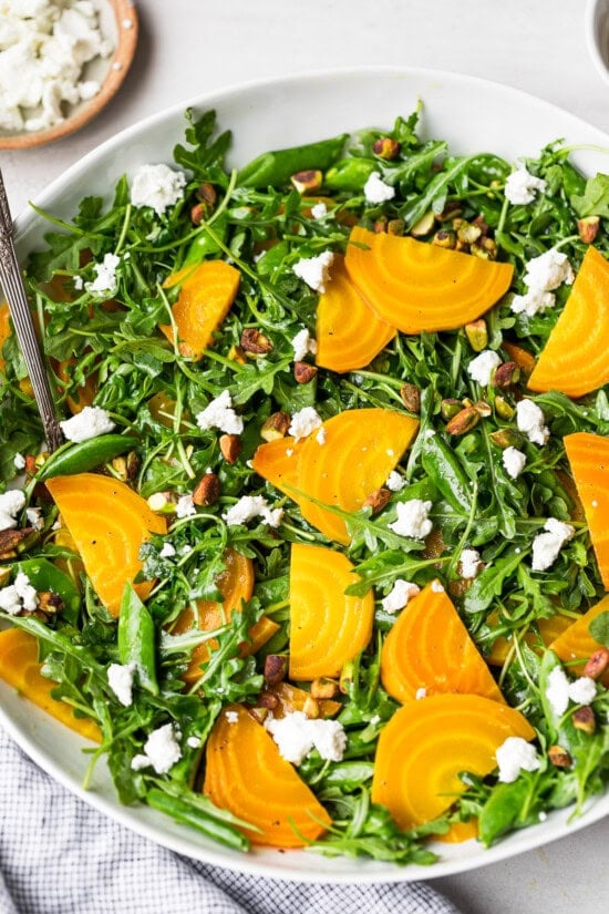 Serve over arugula with goat cheese and pistachios.