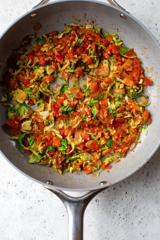 brussels and tomatoes in a skillet