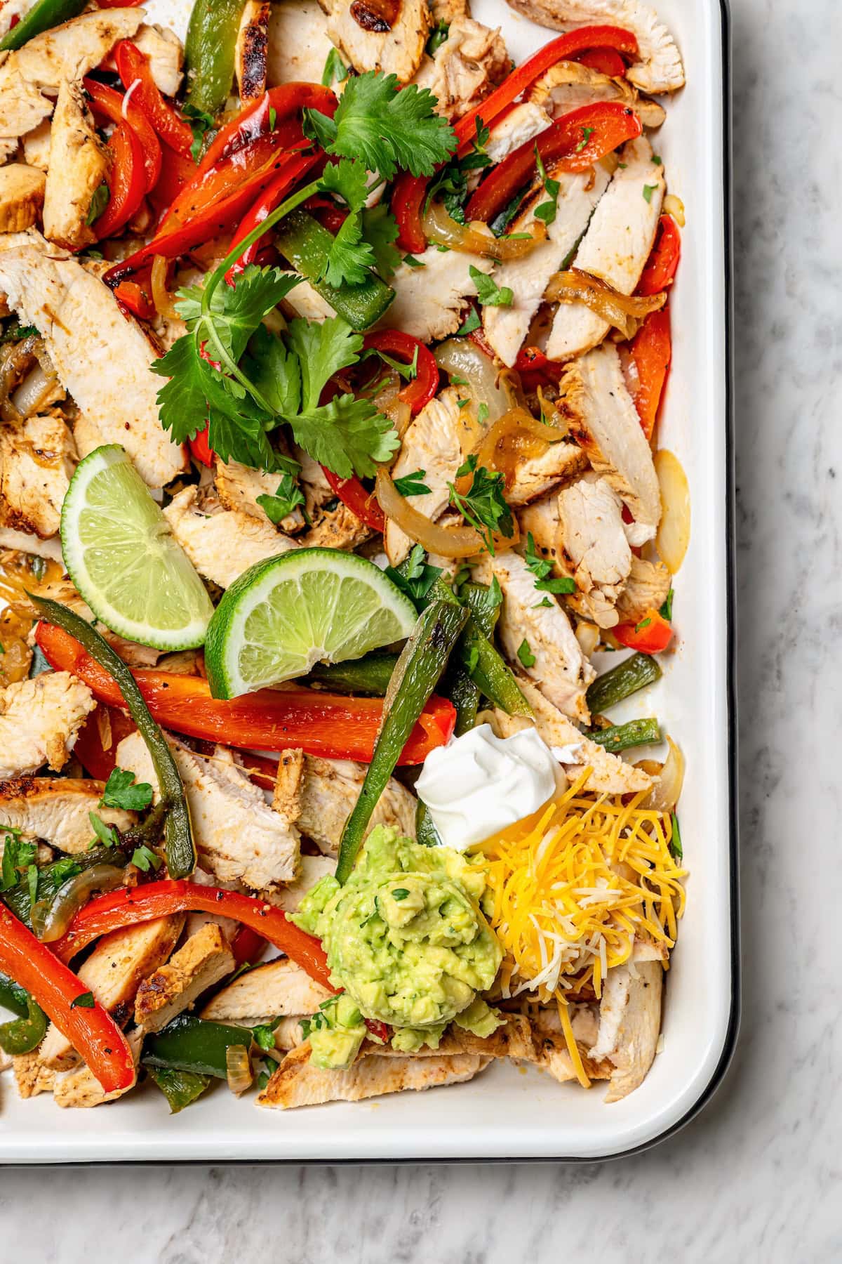 Overhead view of chicken fajitas in pan