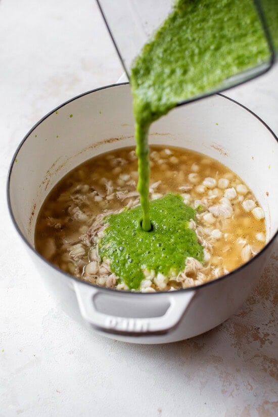 Pour salsa verde sauce into the stew.