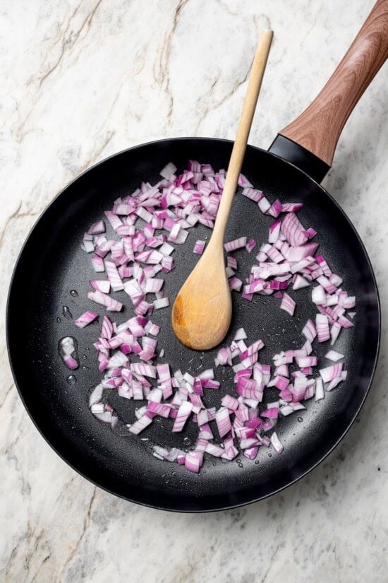 Red onions cooking in skillet