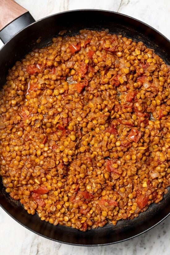 Overhead view of lentils cooked in skillet