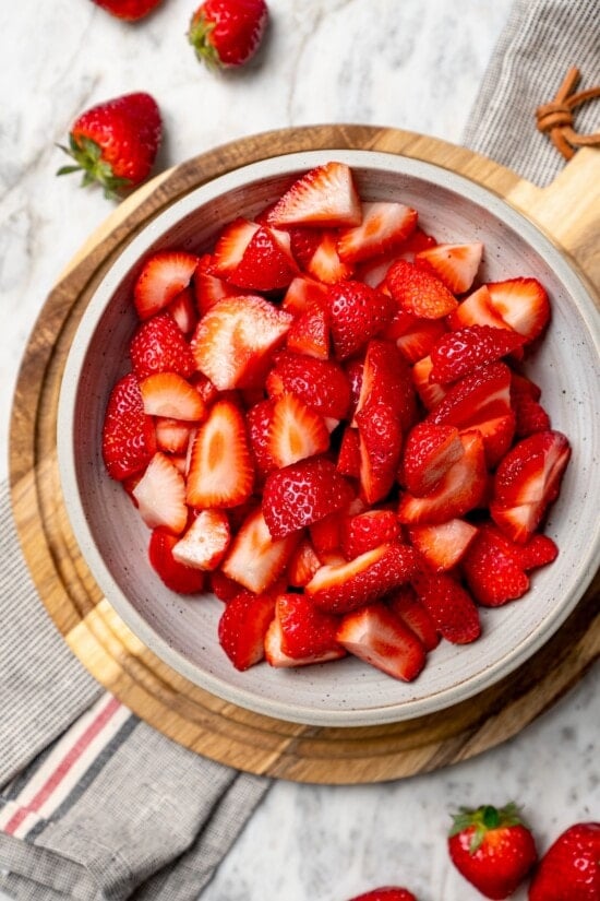 Fresh quartered strawberries in bowl