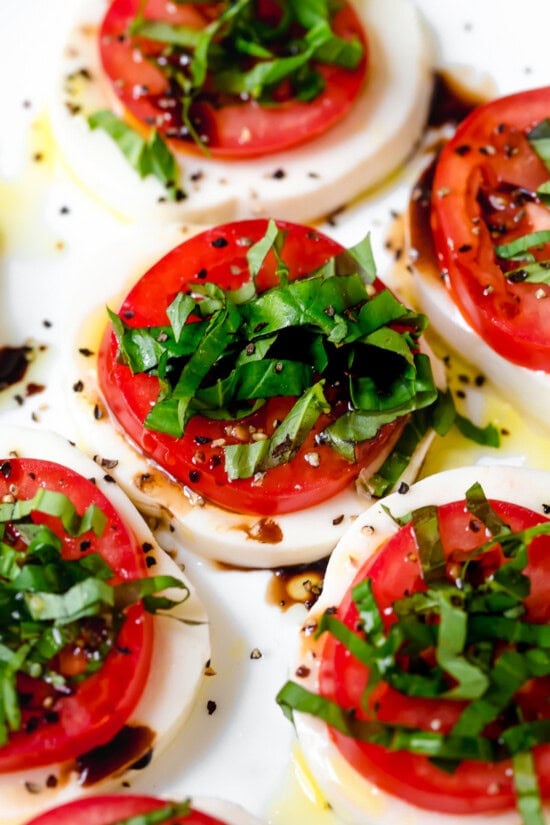 Caprese salad arranged on platter