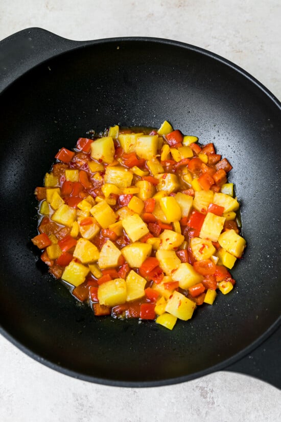 Add bell peppers, pineapple and sweet chili sauce.
