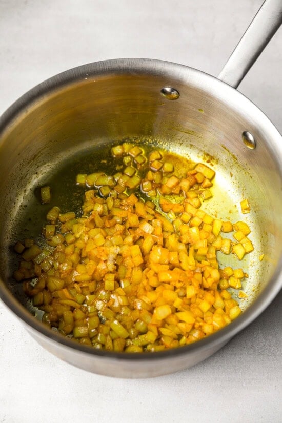 Saute the aromatics with turmeric