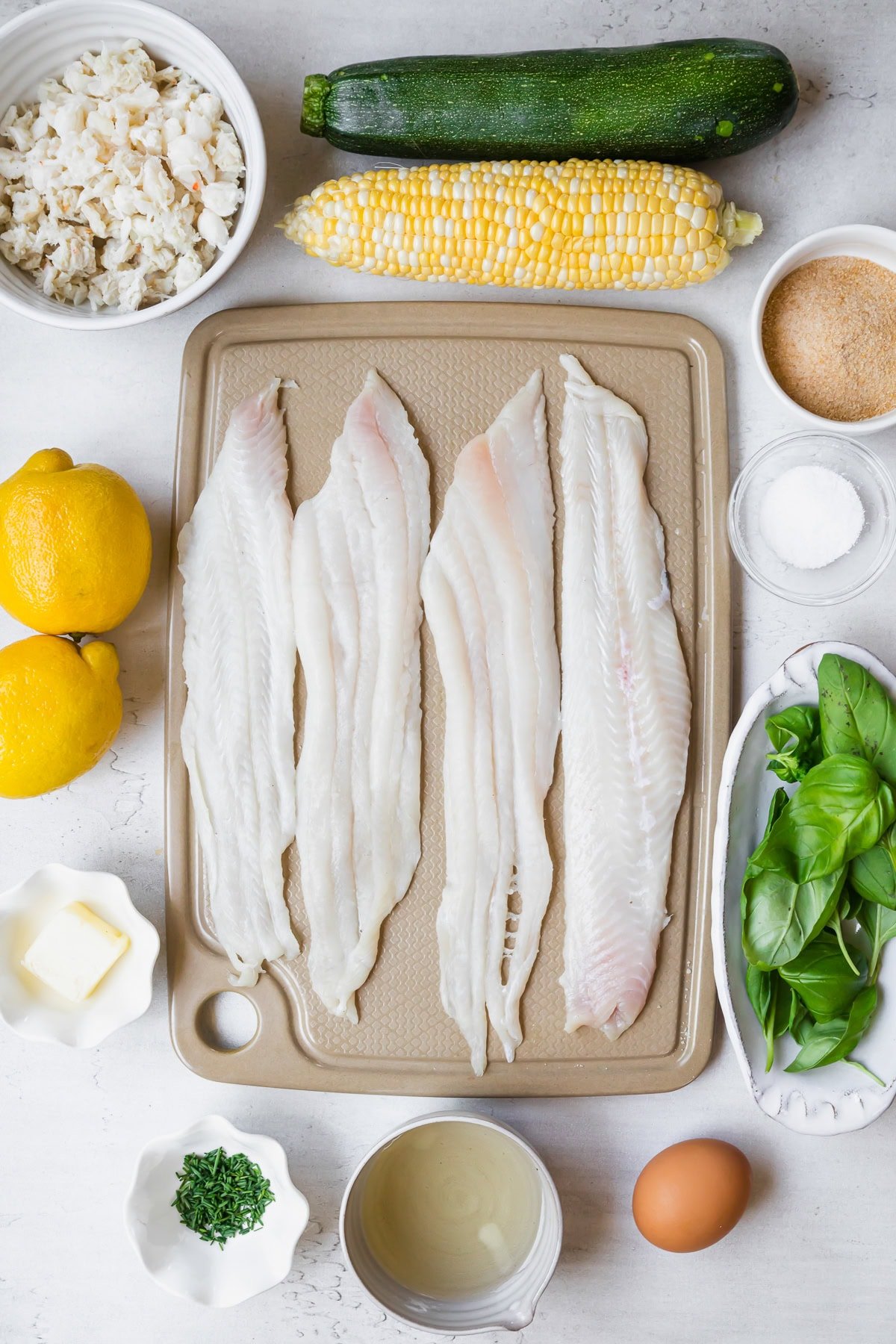 raw fish, corn, lemons and crab