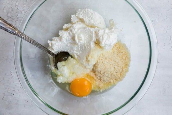Combine ricotta, egg and cheese