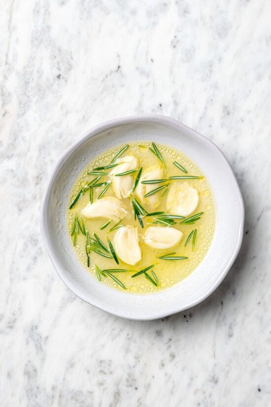 Overhead view of garlic rosemary marinade for lamb chops in bowl