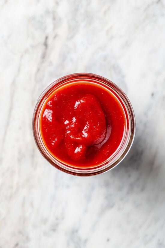Overhead view of homemade ketchup in jar