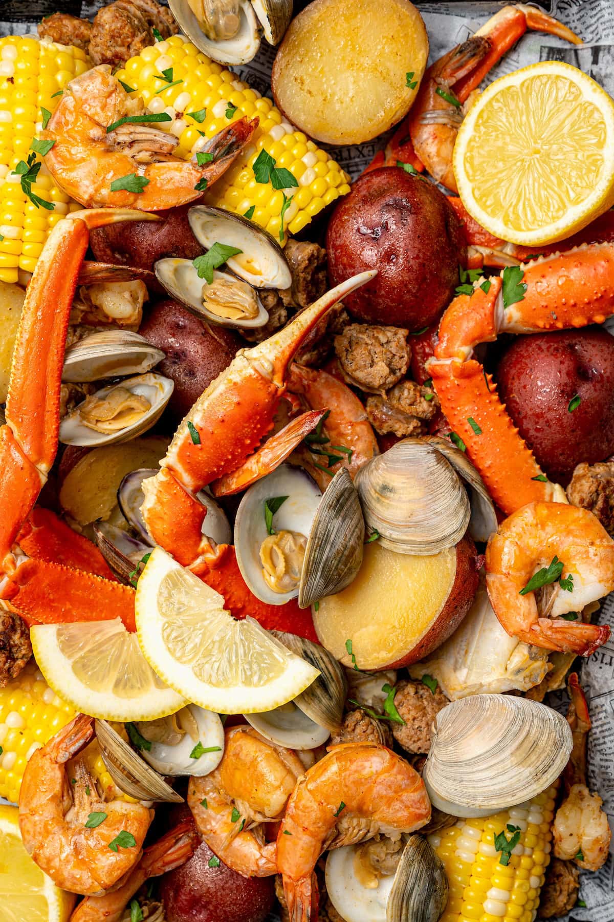 Overhead view of seafood boil with lemon slices