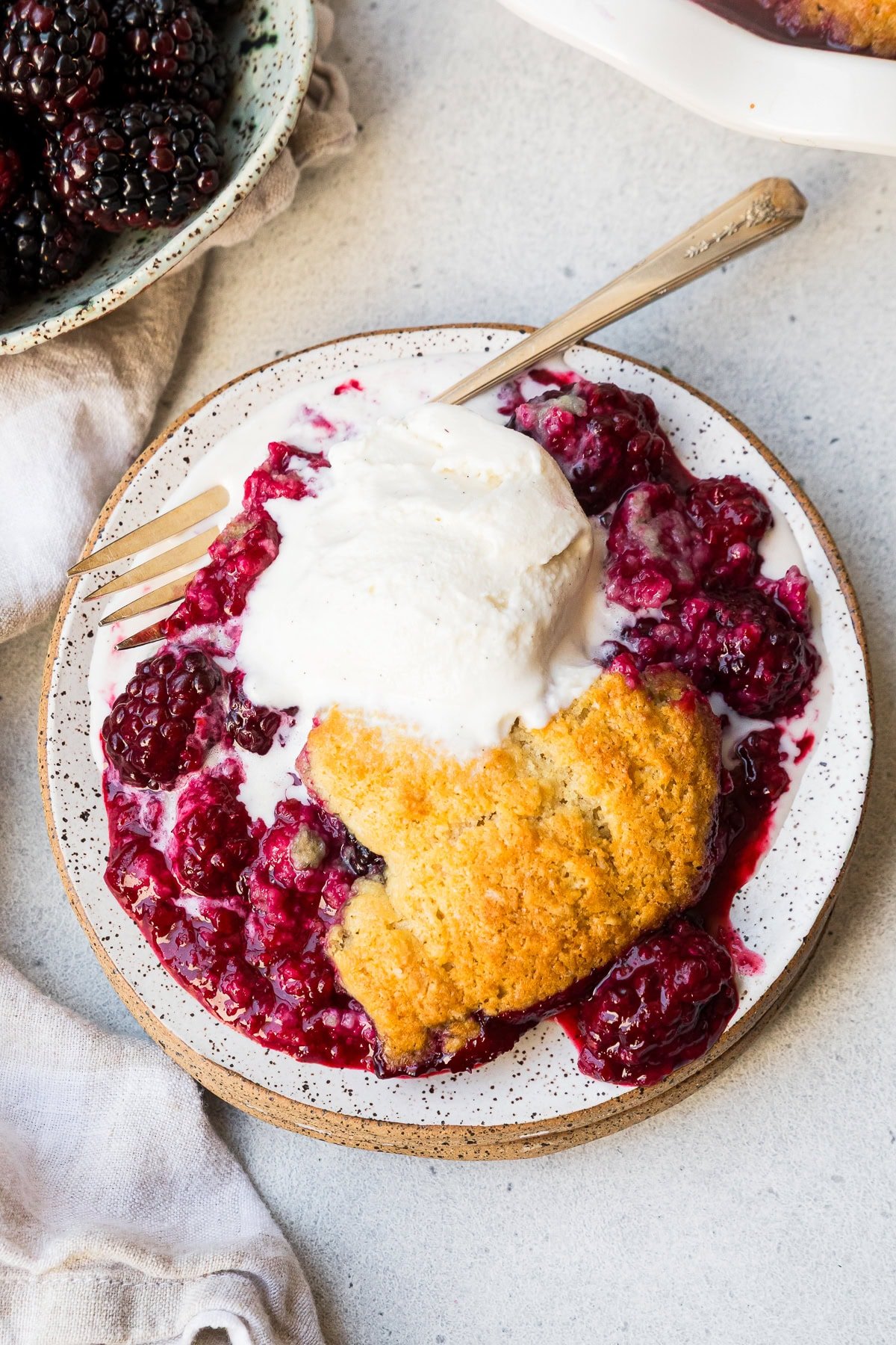Blackberry Cobbler with ice cream on a plate