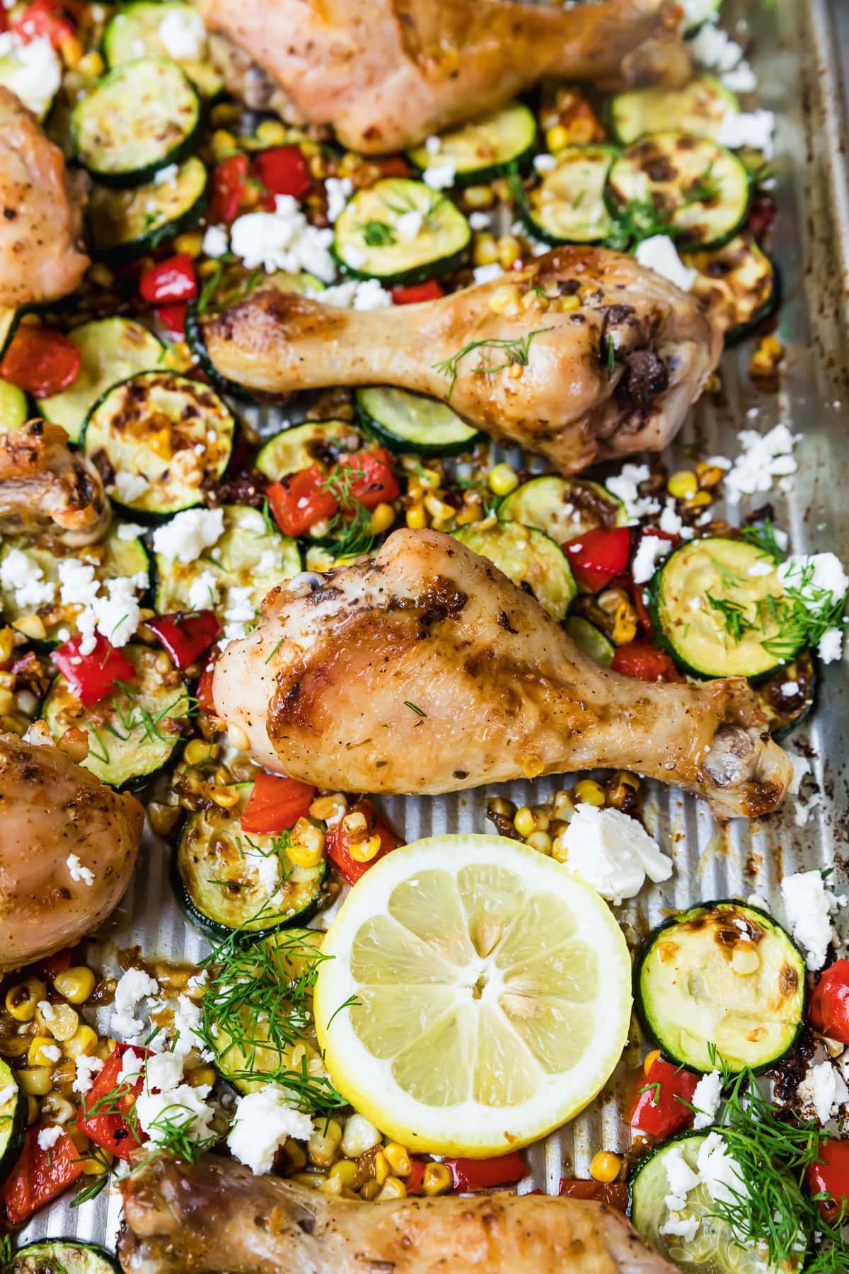 Sheet Pan Chicken Drumsticks with Zucchini, Lemon, Corn and Feta