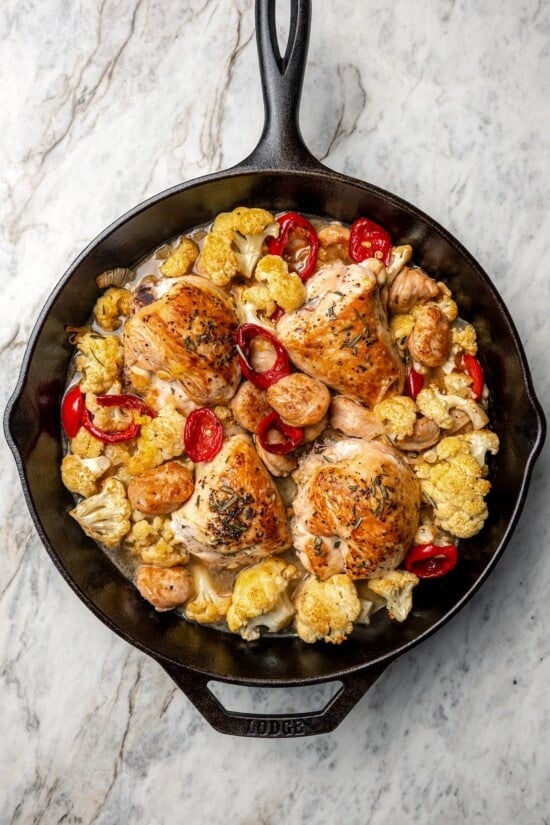 Chicken scarpariello in cast iron skillet.