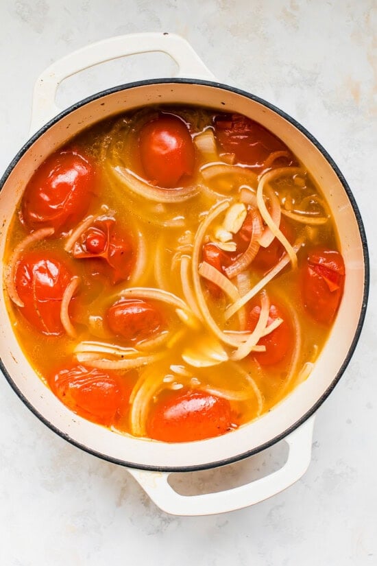 Simmer the onions, garlic and tomato