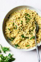 Bowl of rice pilaf with fork.