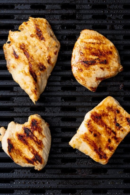 Chicken breasts on grill.