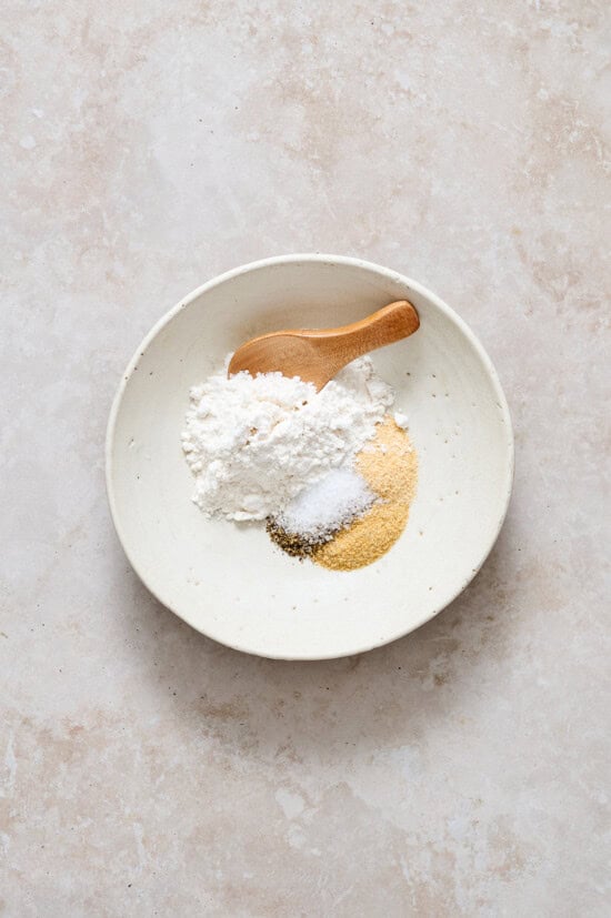 Combine flour and seasoning