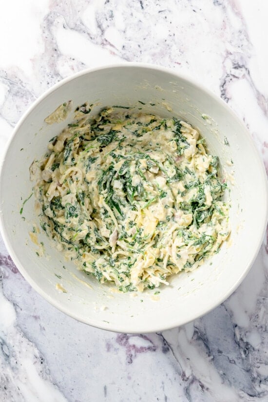 Spinach Artichoke Dip ingredients in a bowl