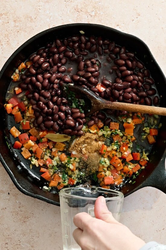 skillet with black beans and spices