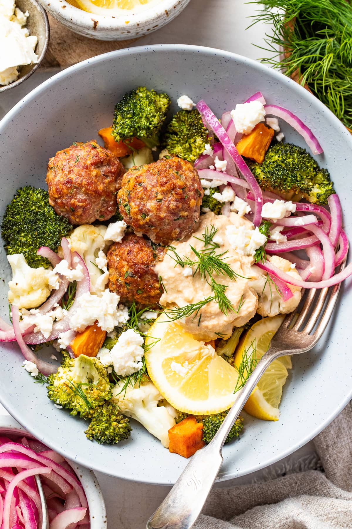 Sheet pan Mediterranean meatball bowls with roasted vegetables, turkey meatballs and hummus