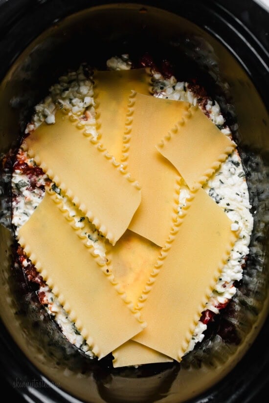 layer the lasagna noodles in the slow cooker