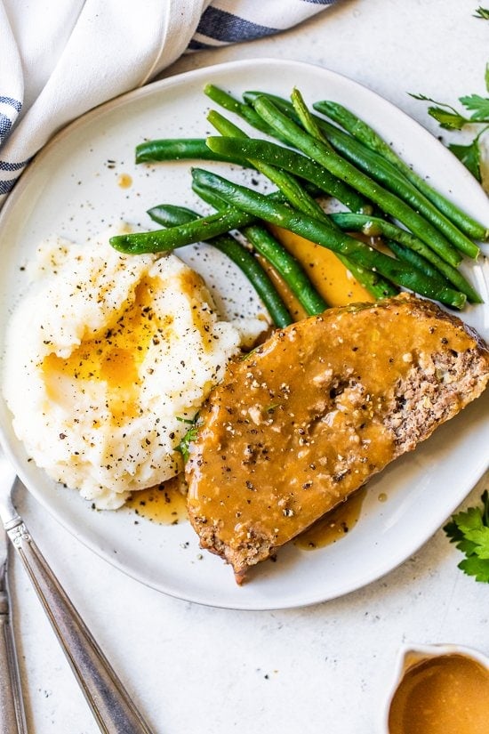 Meatloaf and Gravy with mashed potatoes and green beans.
